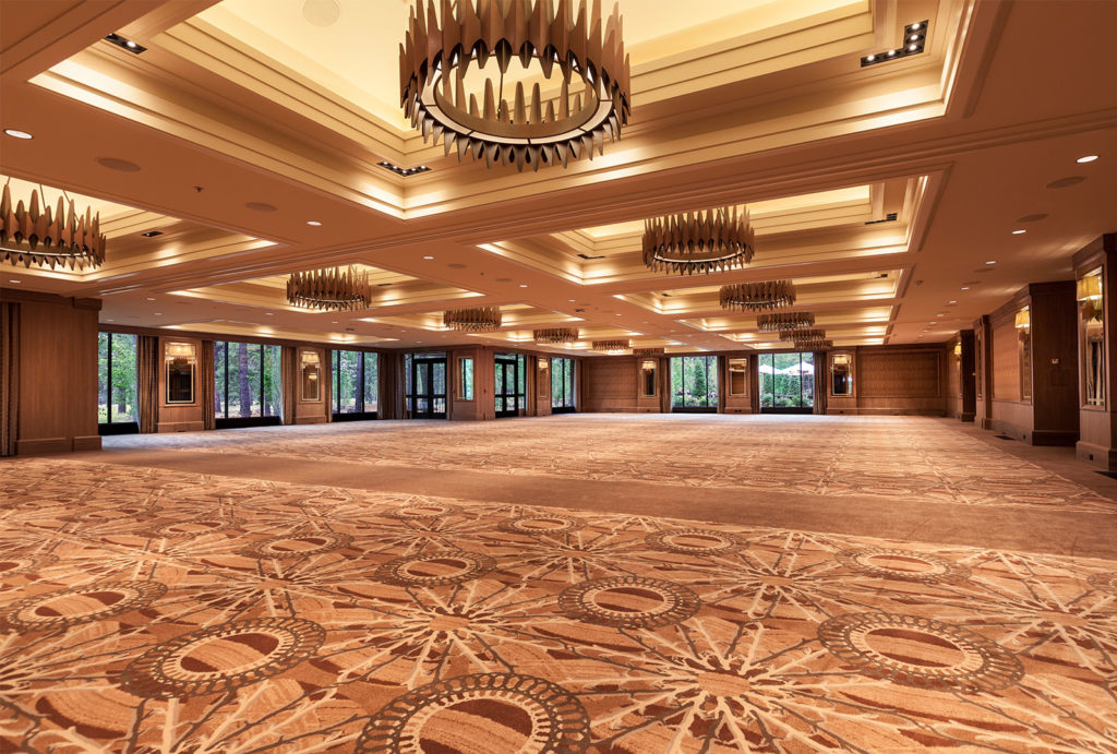 Empty Grand Ballroom with floor to ceiling windows and wood chandeliers