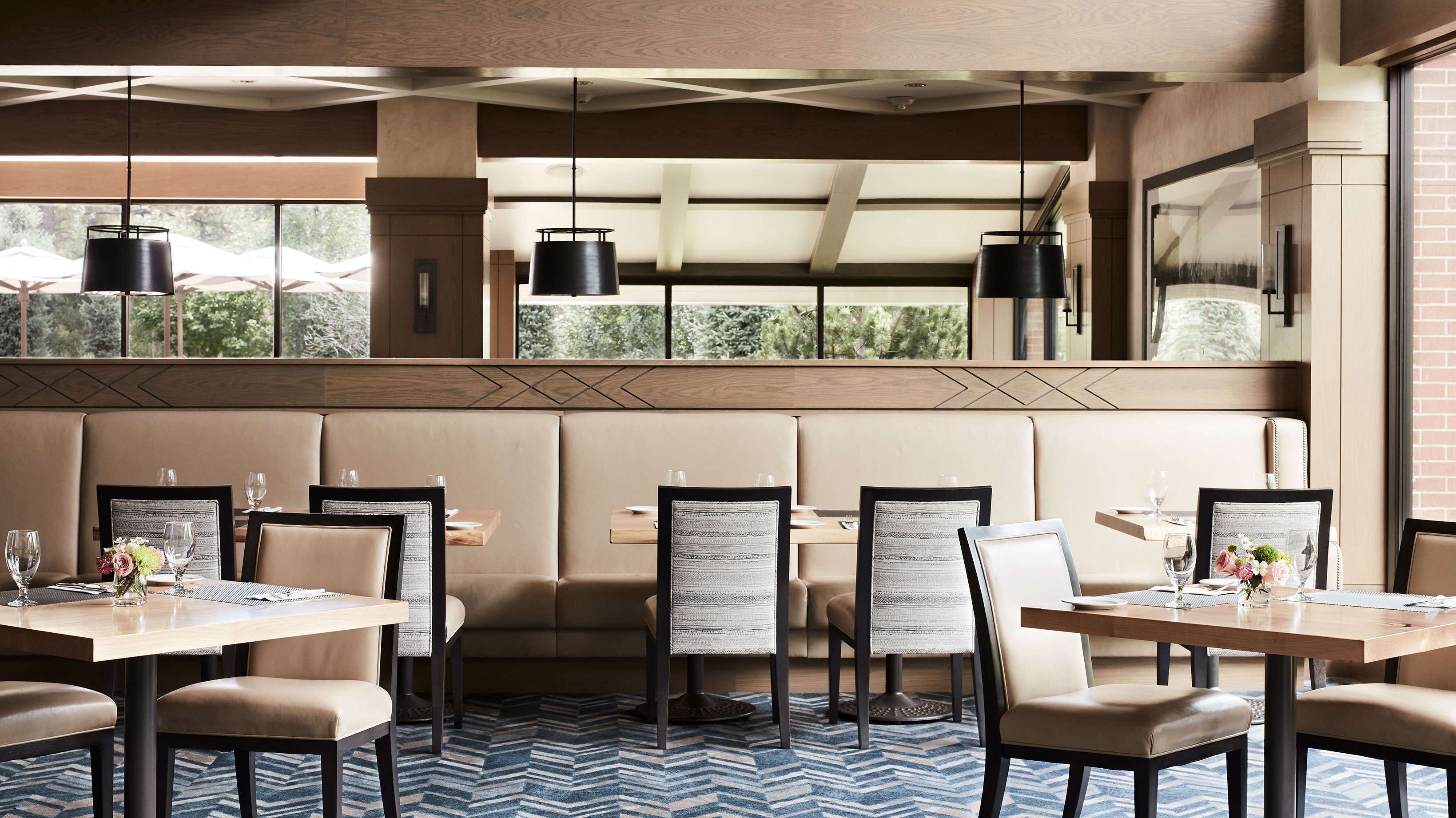 Tables set with glasses and silverware in the Silver Pine Restaurant