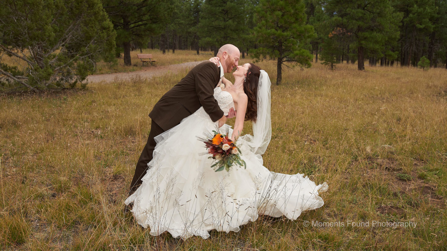 Groom dips Bride near the Nature Path
