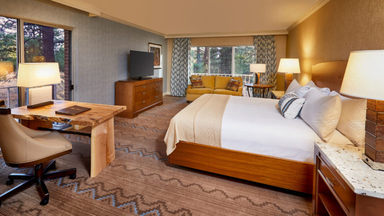 Bed, desk, and sofa in the King Room