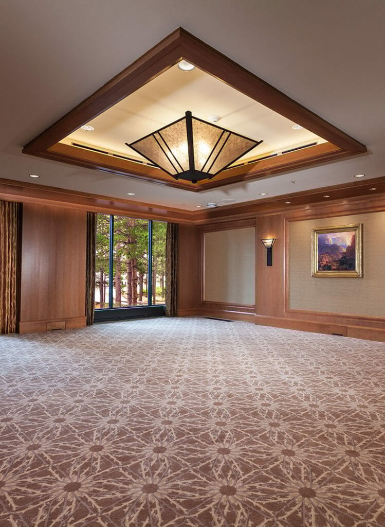 The Aspen meeting room at the Little America Hotel in Flagstaff, AZ featuring floor to ceiling windows for natural lighting.