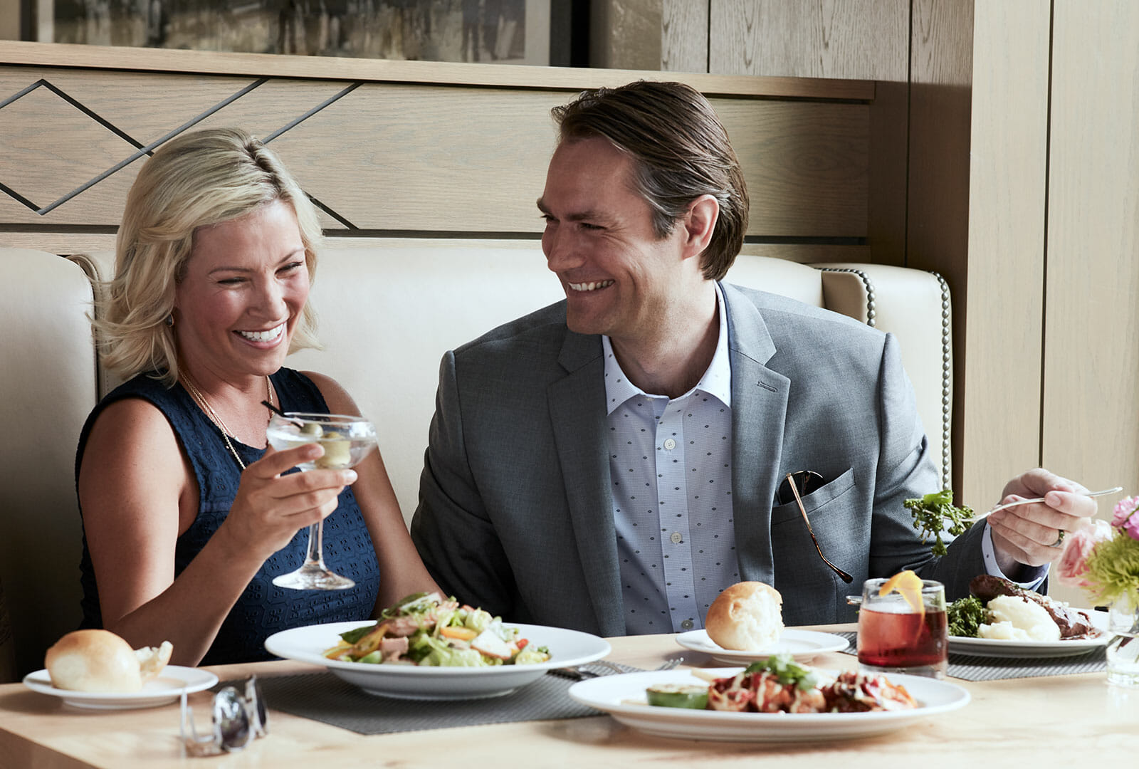 Couple laughs while enjoying a drink and dinner at the Silver Pine Restaurant