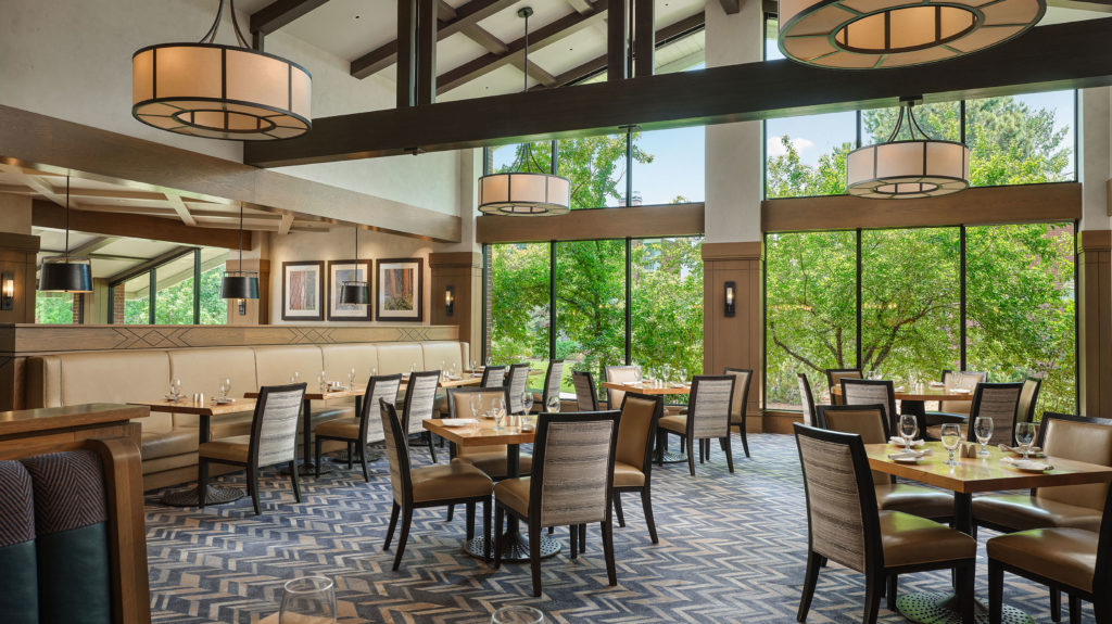 Tables set with glasses and silverware in the Silver Pine Restaurant